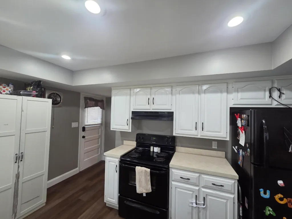 Kitchen cabinet painting West Chester - white cabinets with recessed lighting and professional transformation