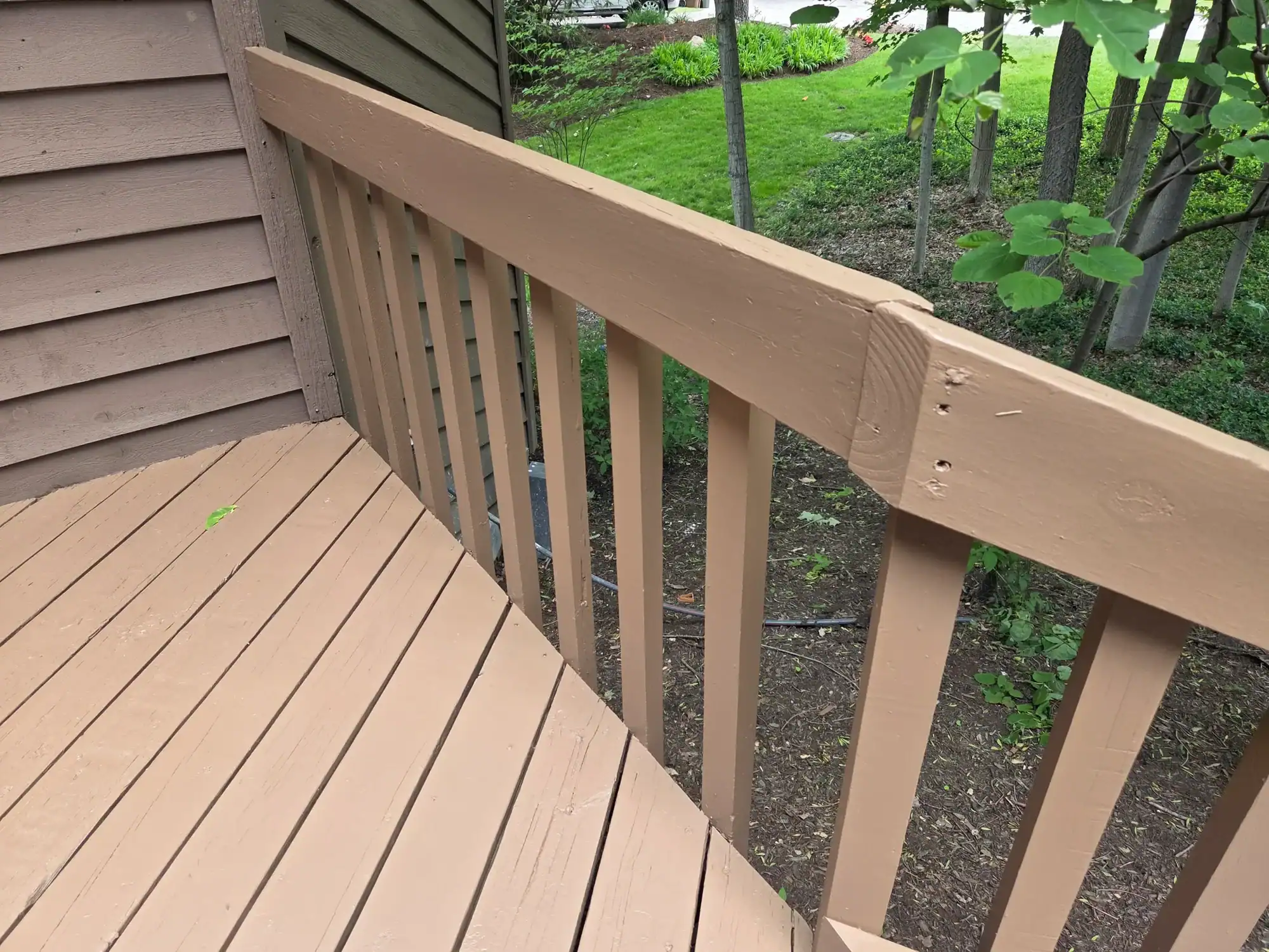 Deck staining Hamilton Ohio - deck railing corner detail with professional wood finish